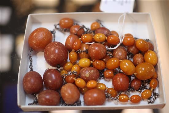 Two single strand amber bead necklaces, longest 56in.